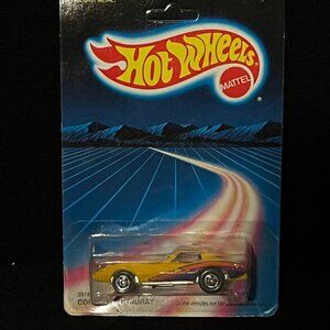 Vintage 1987 Hot Wheels Corvette Stingray #3974 in yellow with a pink stripe NEW